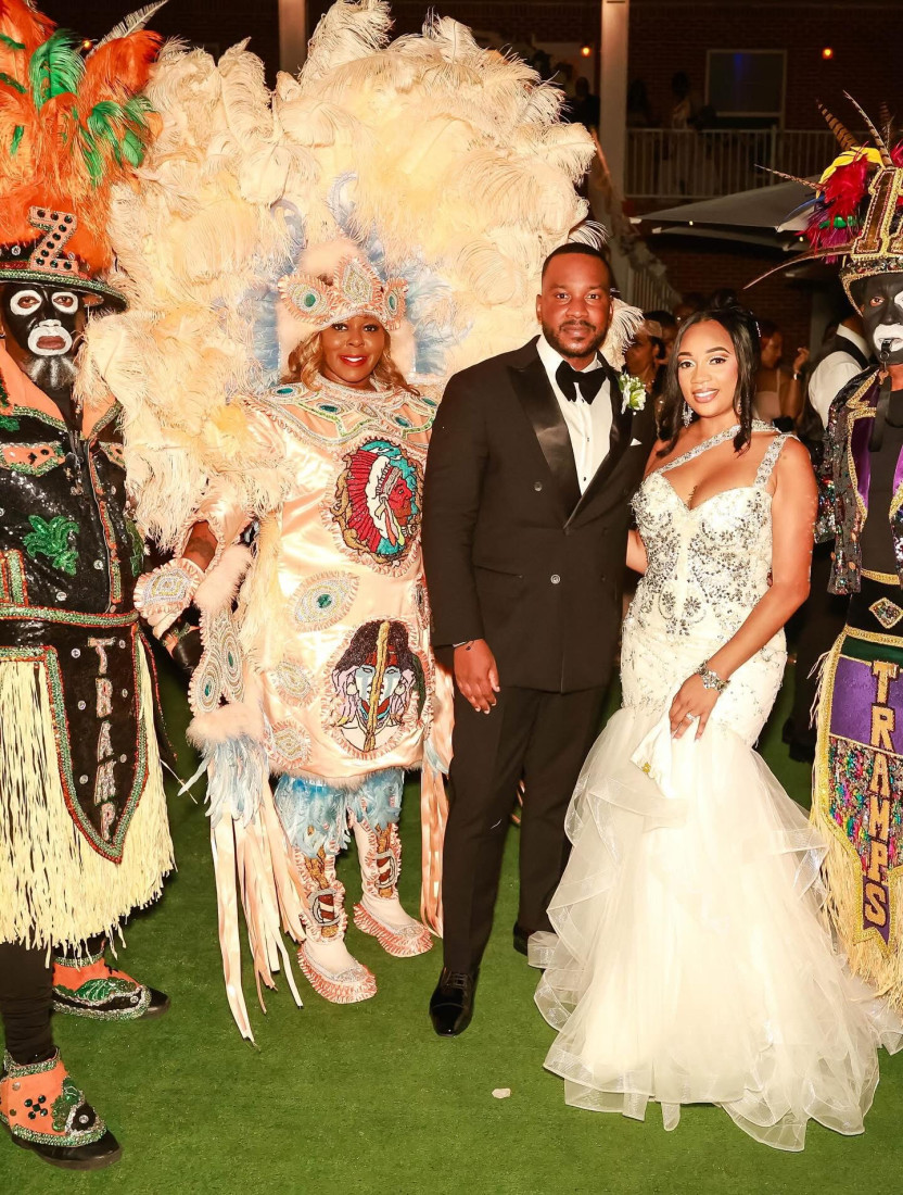 Wedding couple with Mardi Gras Indian performers